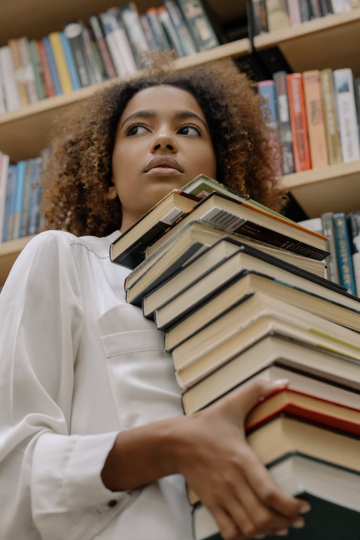 Woman Carrying Books